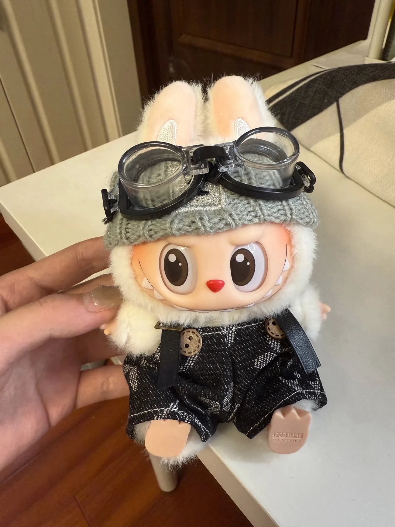 Labubu wearing a trendy street-style black outfit