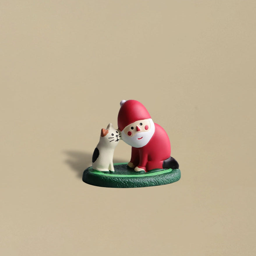 Santa Claus and a black cat touching faces affectionately, cute and heartwarming Christmas decoration.