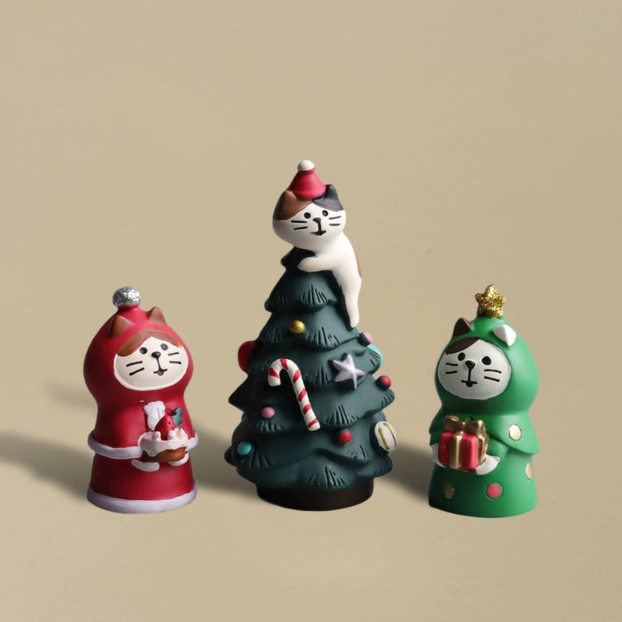 A cute cat climbing a Christmas tree