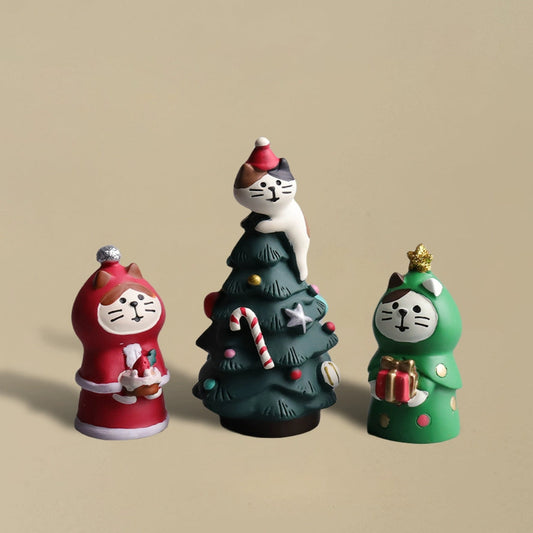 A cute cat climbing a Christmas tree