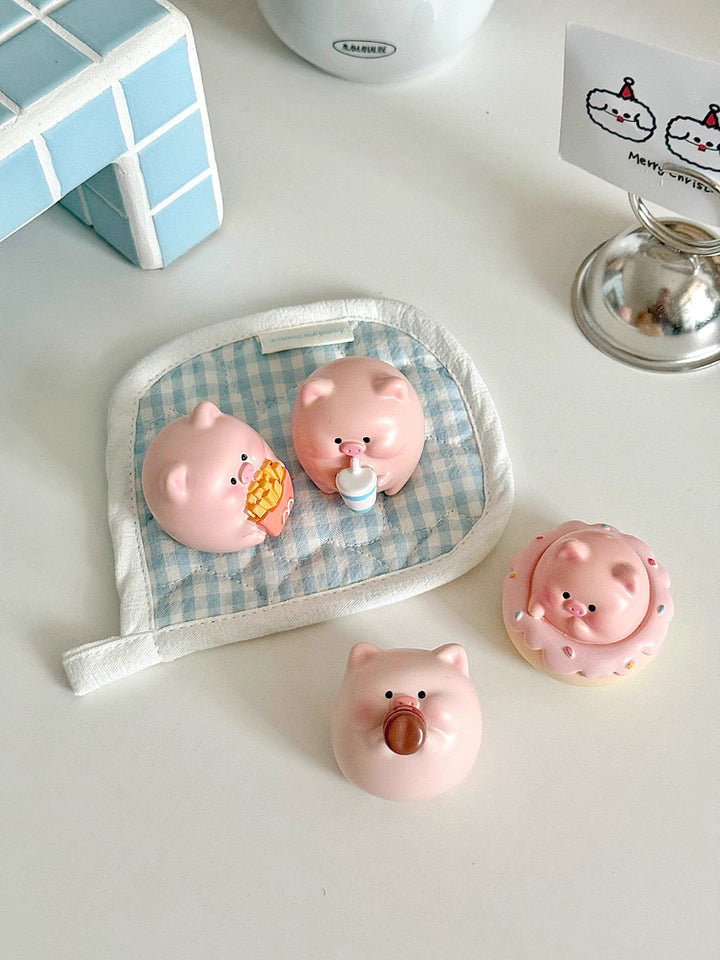 Four adorable piggy figurines with playful expressions, perfect for brightening up your desktop.
