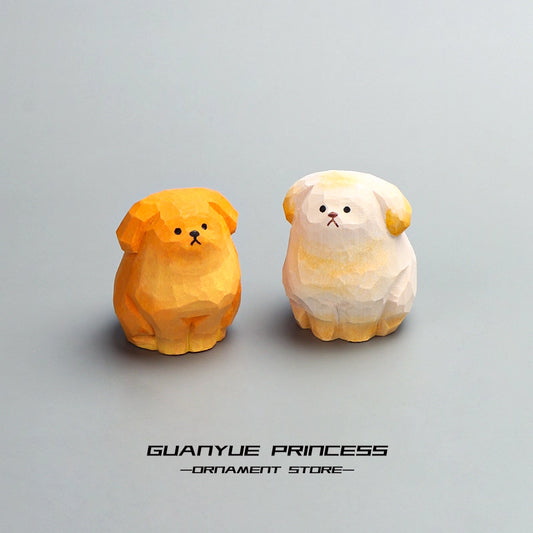Two hand-carved basswood golden retriever puppies sitting together