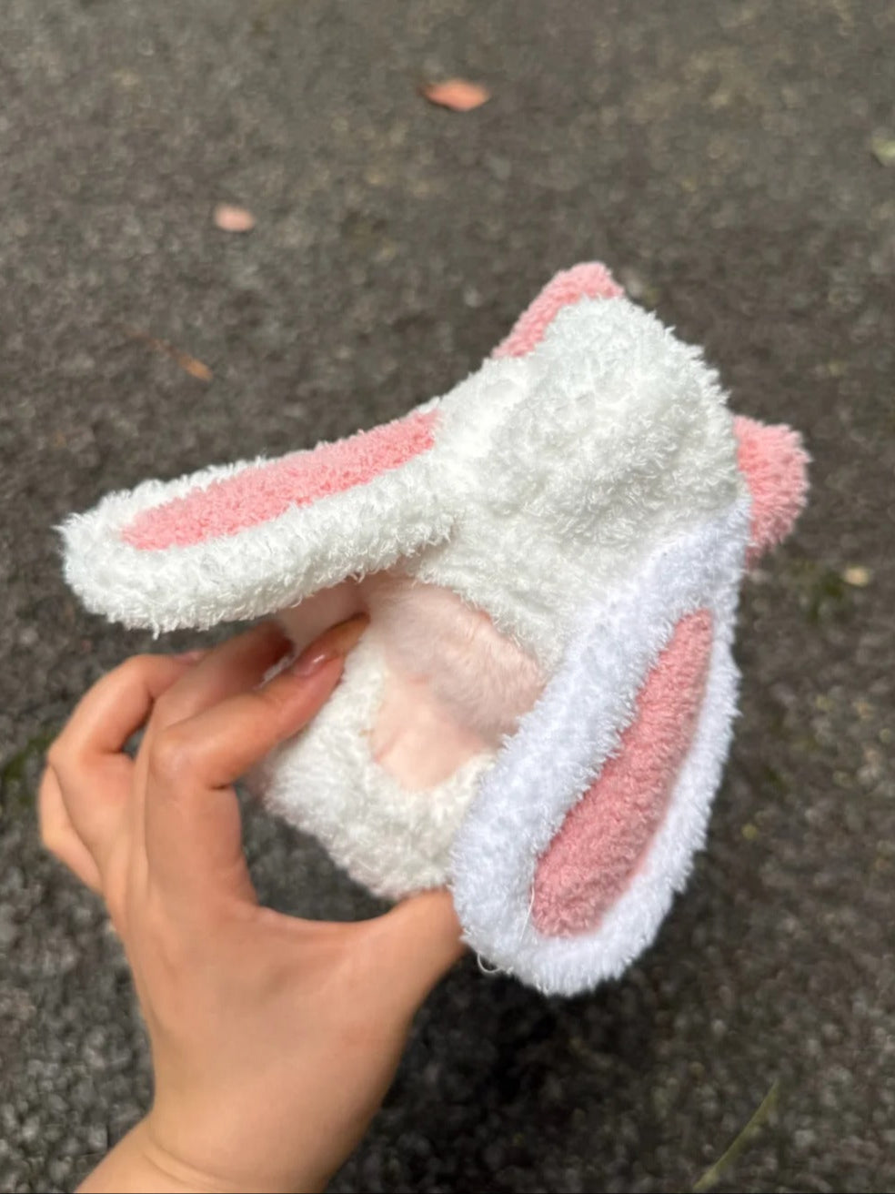 Labubu wearing a cute bunny outfit with floppy ears