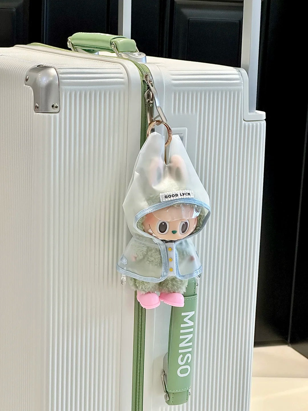 Labubu wearing an adorable raincoat on a rainy day