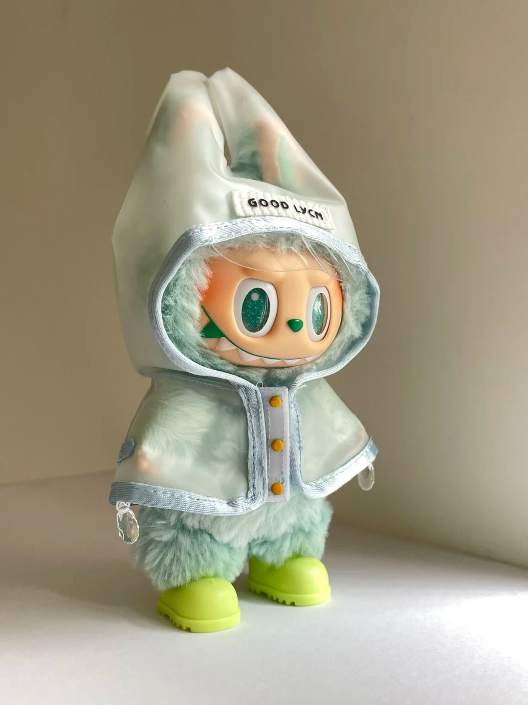 Labubu wearing an adorable raincoat on a rainy day