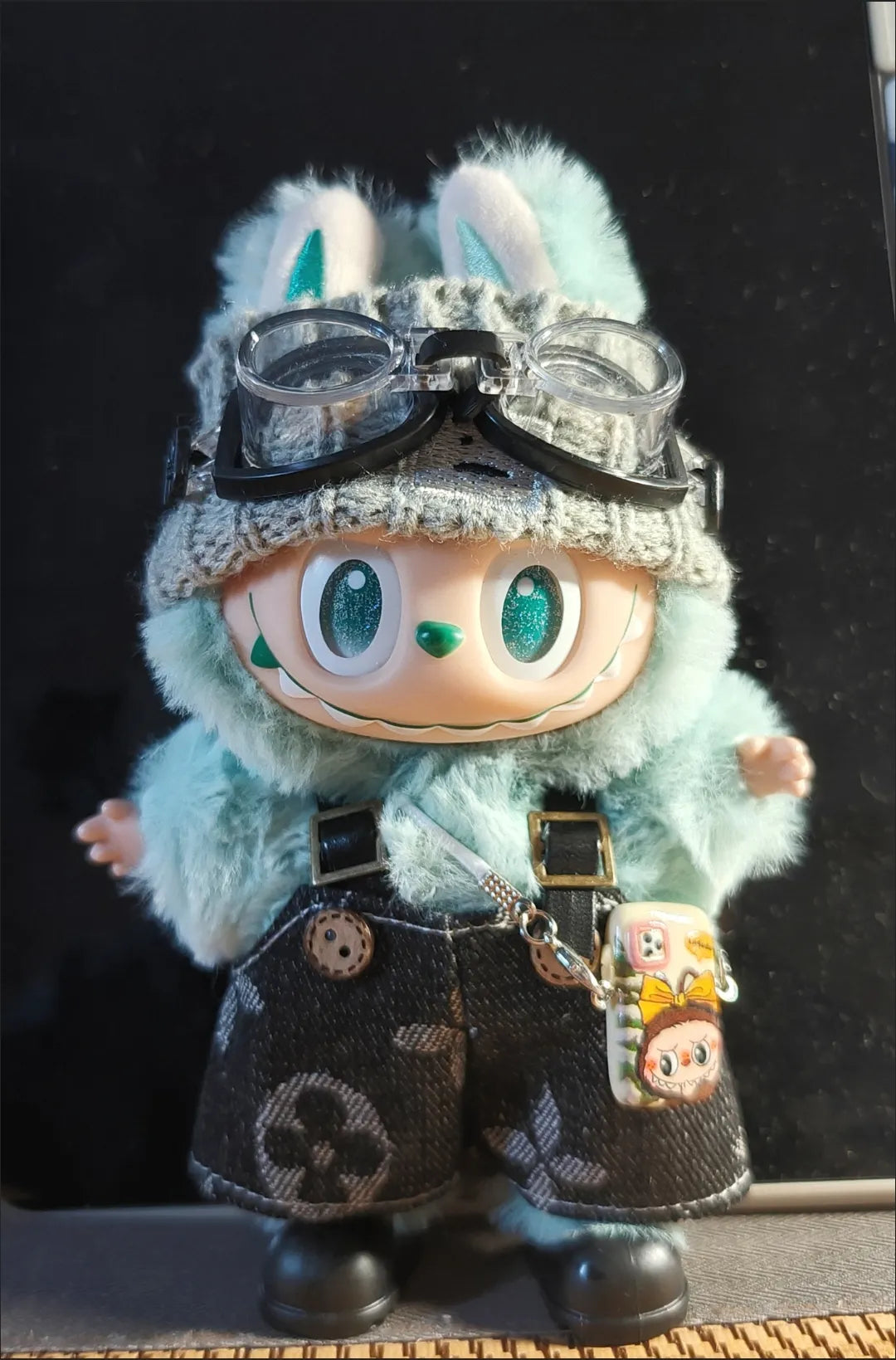 Labubu wearing a trendy street-style black outfit