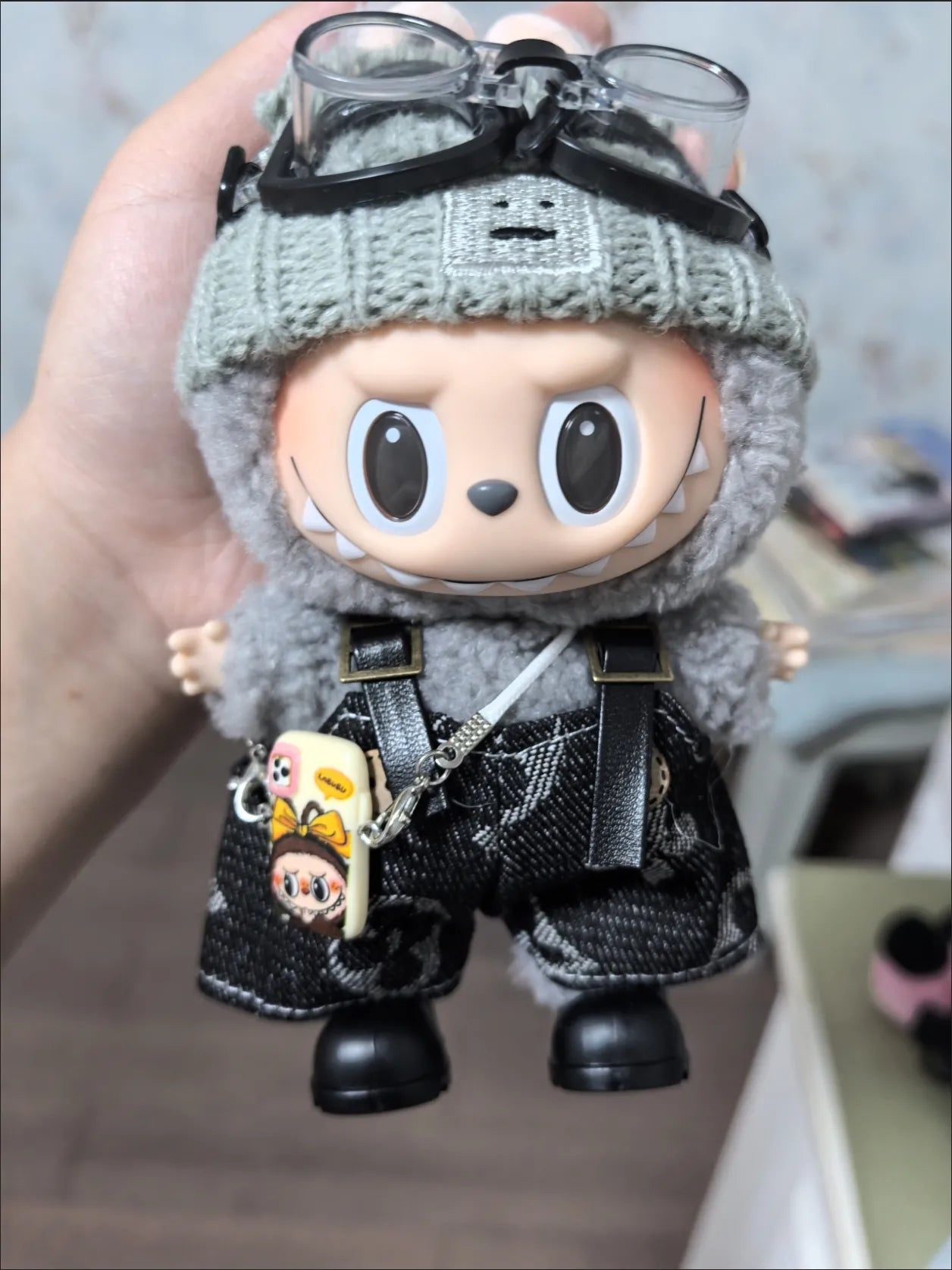 Labubu wearing a trendy street-style black outfit
