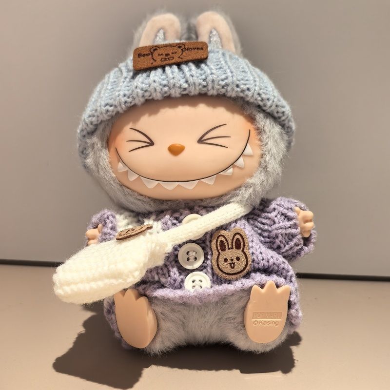 Labubu in a warm knitted winter outfit
