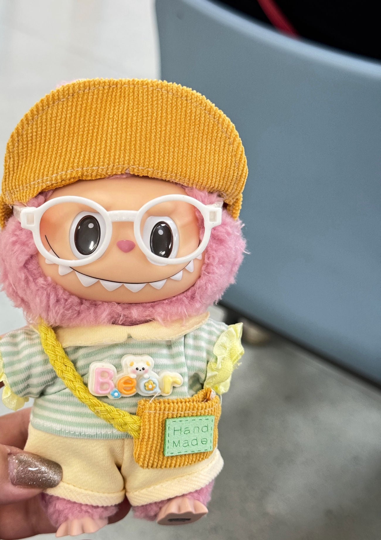 Labubu enjoying a sunny picnic in a cheerful outfit