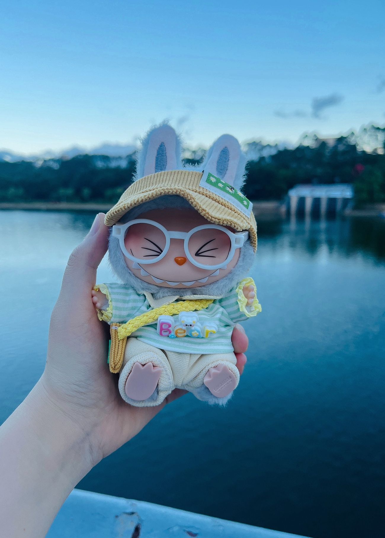 Labubu enjoying a sunny picnic in a cheerful outfit