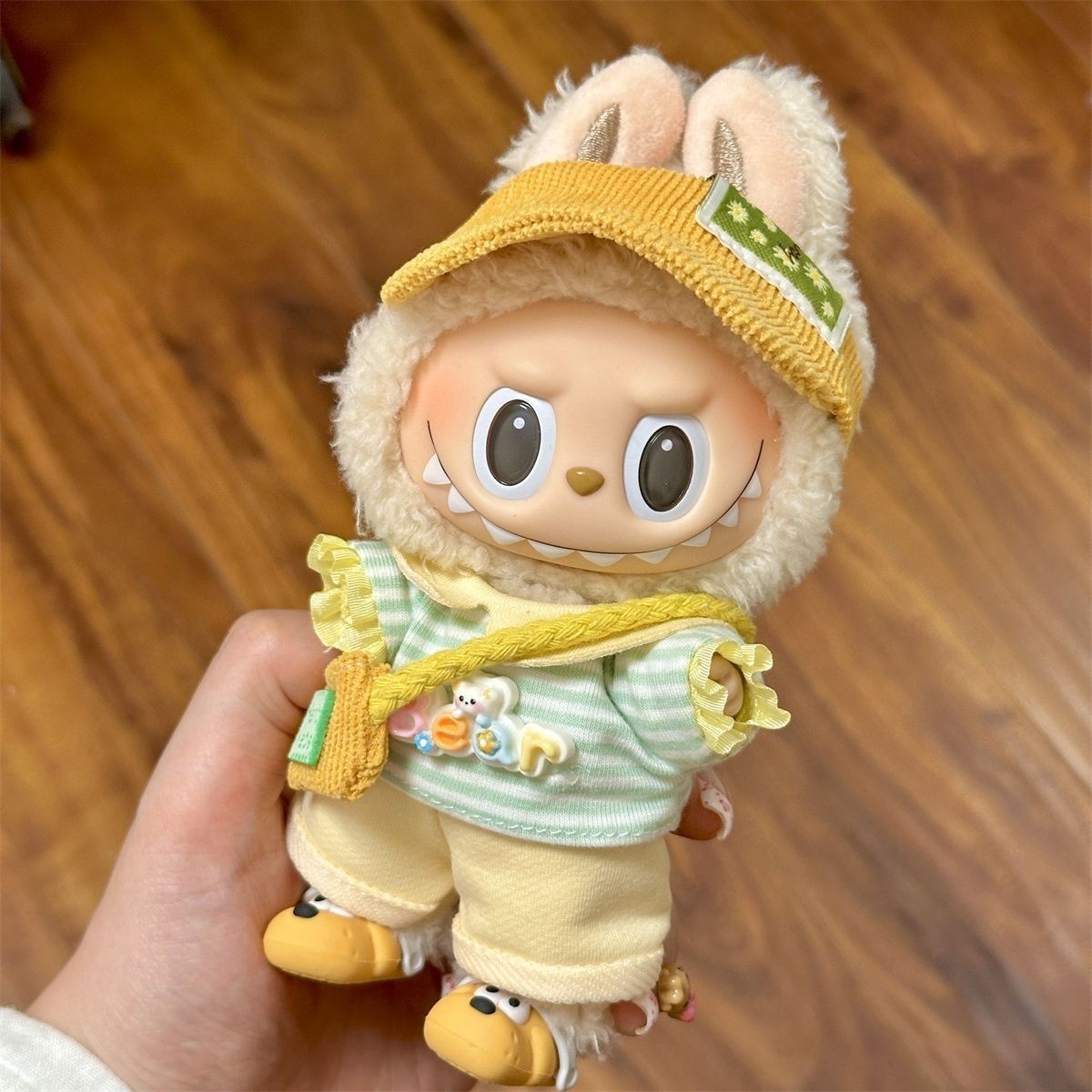 Labubu enjoying a sunny picnic in a cheerful outfit