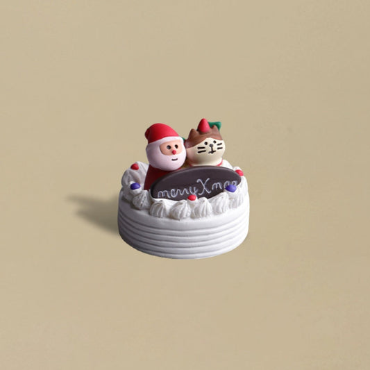 Festive cake featuring Santa and a cat