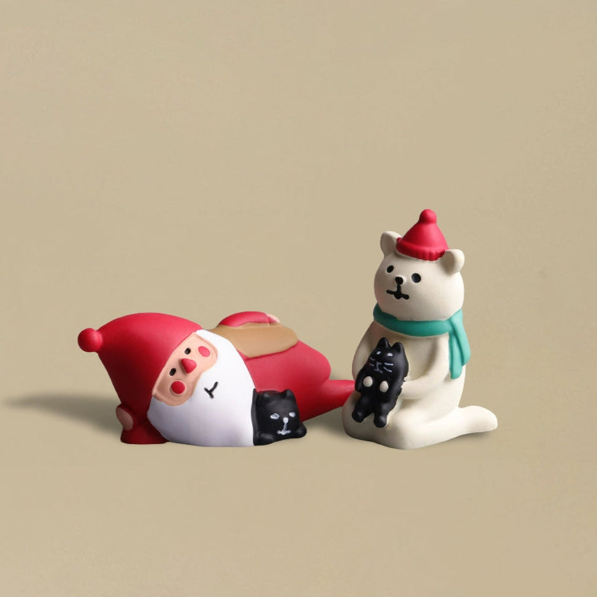 Santa lying down with polar bear hugging black cat - Ornament